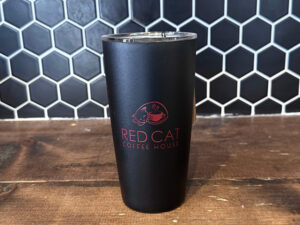 Photo of Red Cat Coffeehouse Black Straw Tumbler, with a red Red Cat Coffeehouse logo